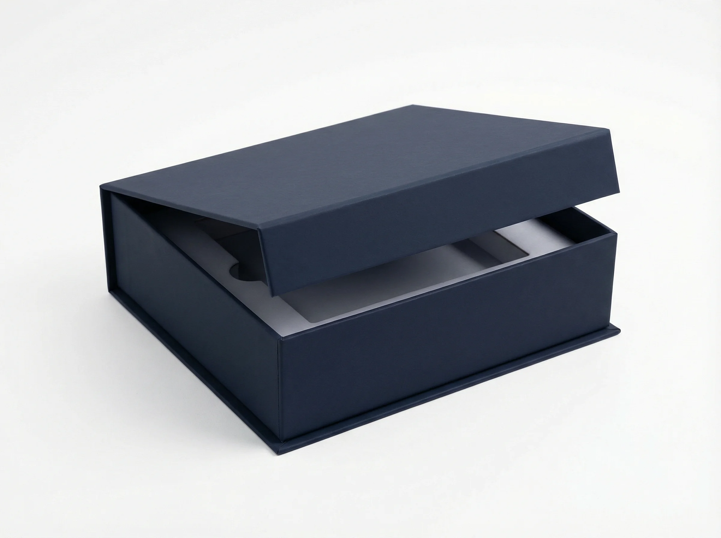 Luxury rigid paper gift box with magnetic closure and custom insert for fragrance brand.