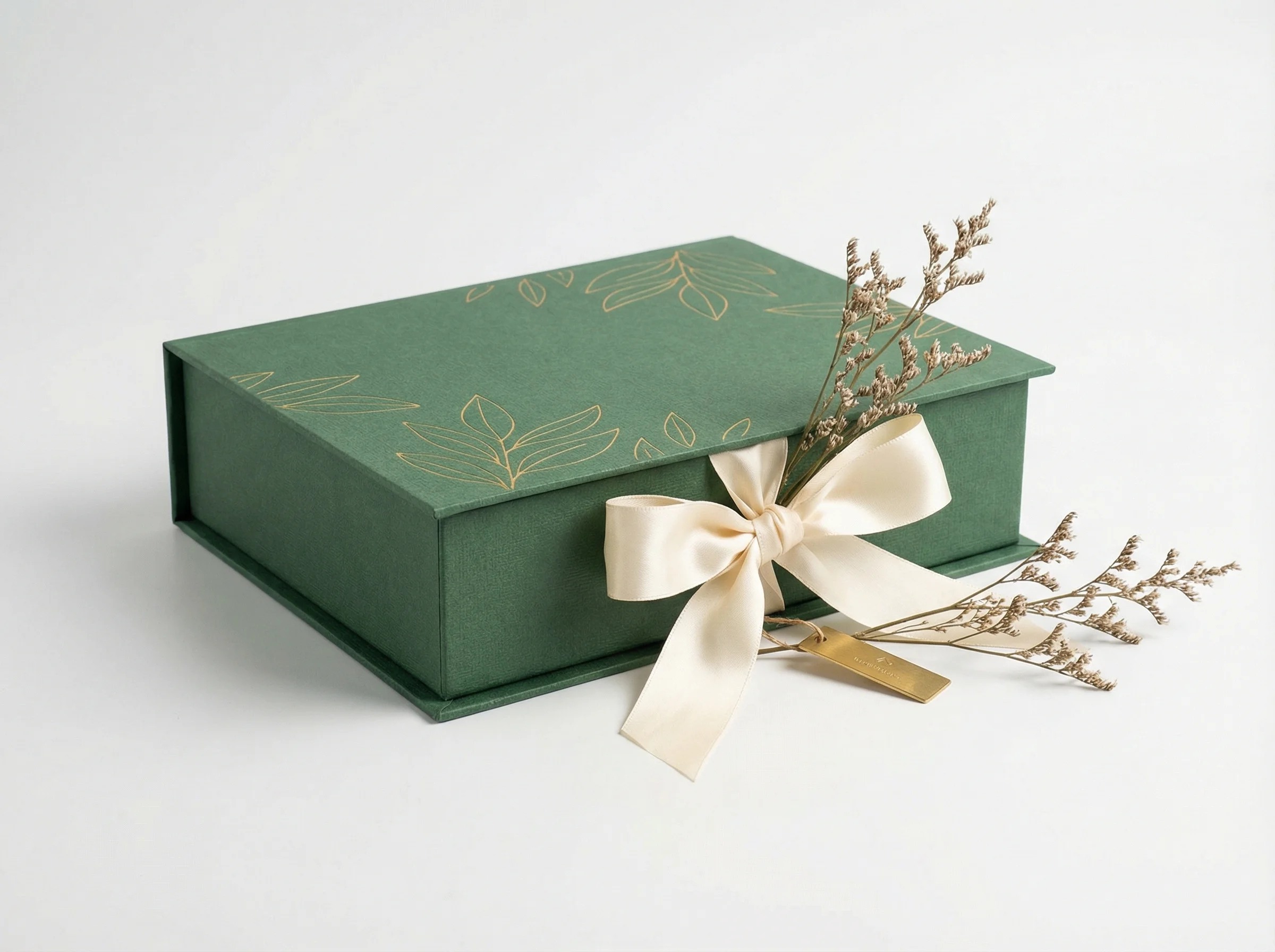 Book-style rigid paper box with ribbon accent for seasonal limited edition packaging.